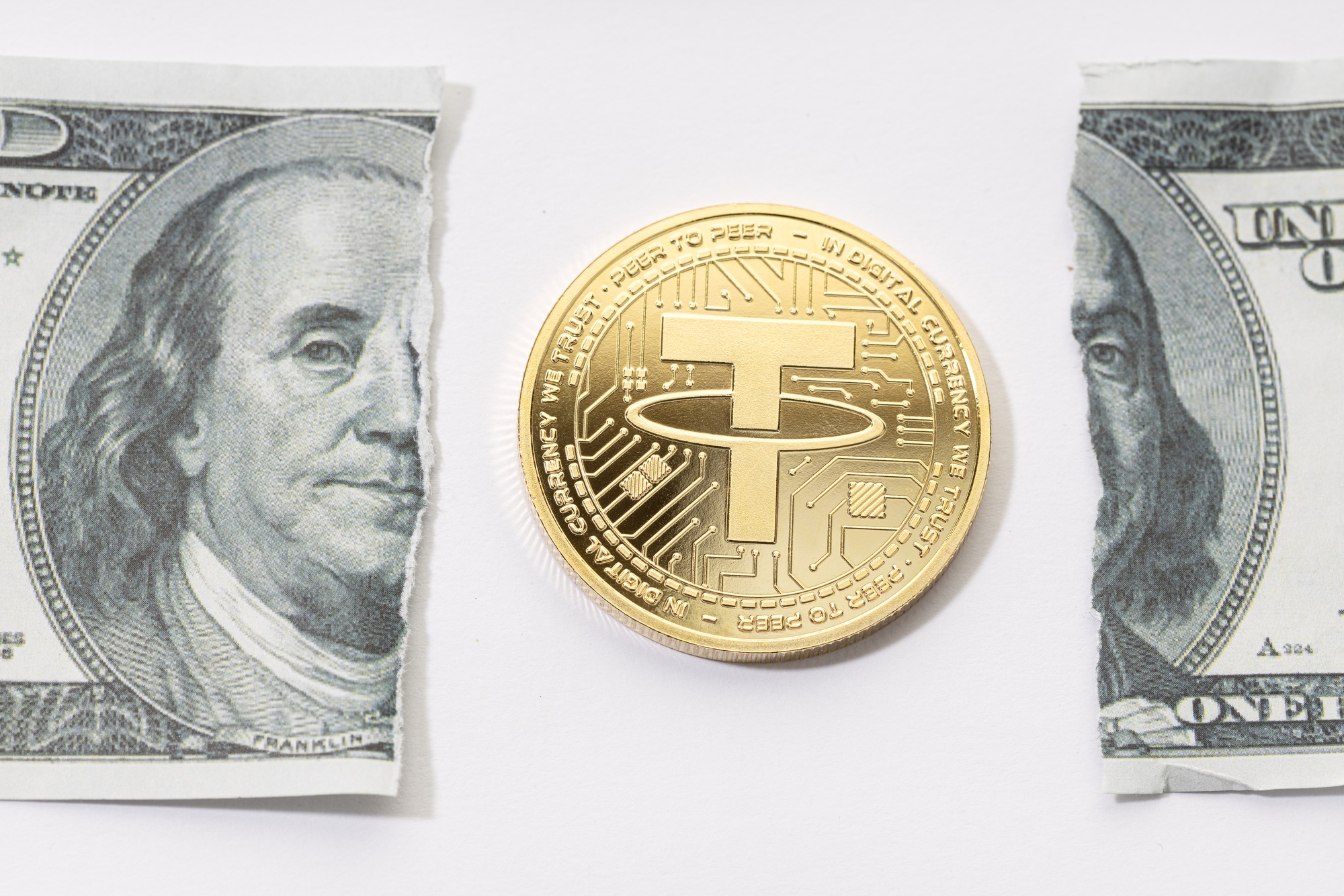 Tether USDT coin and ripped dollar bill